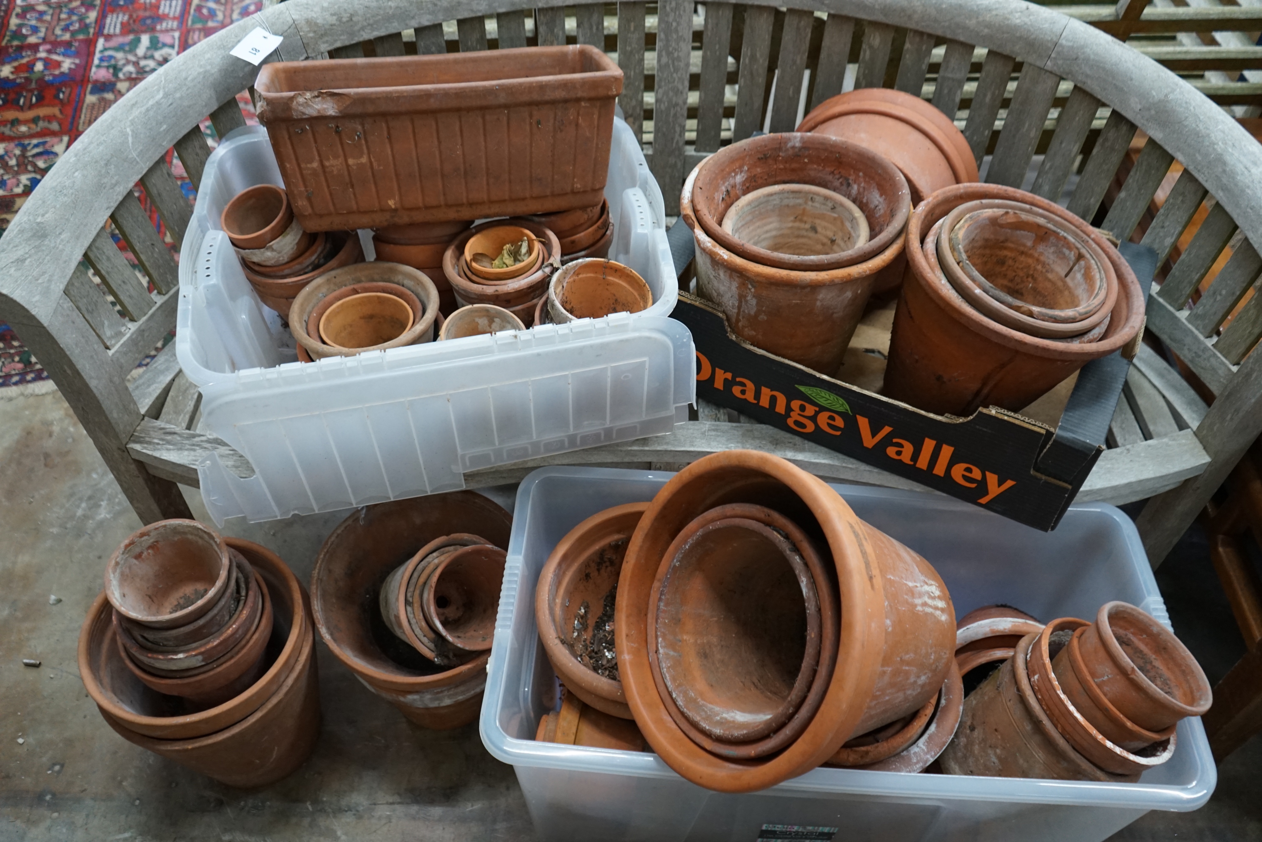 Approximately 100 terracotta garden pots, largest diameter 33cm height 28cm